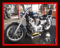 Motorcycle being washed by Fifty Dollar Detail.